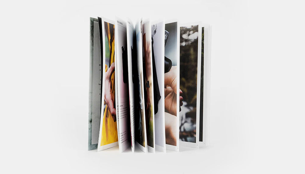 Fanned catalog pages on a light gray background