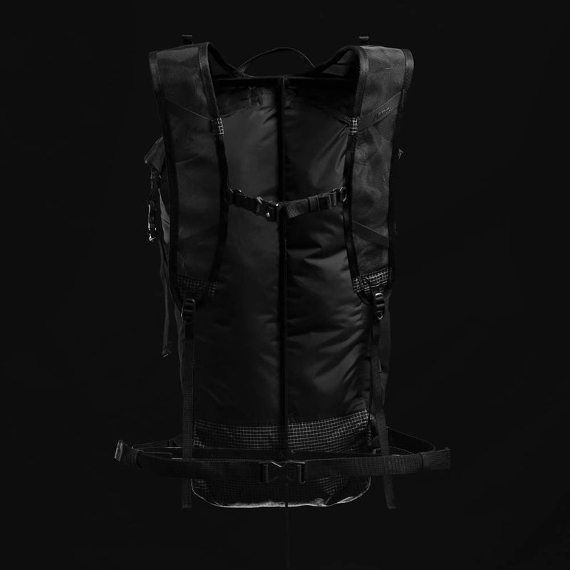 Back view of backpack on black background