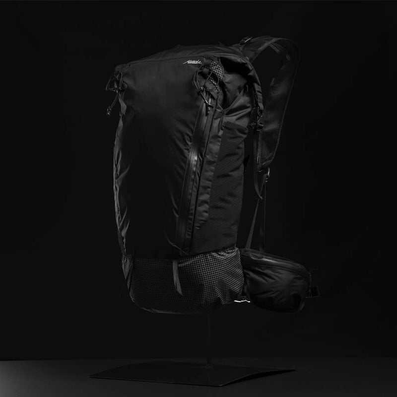 3/4 view of backpack on black background