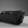 Filled dry bag with rolled top, laying on side