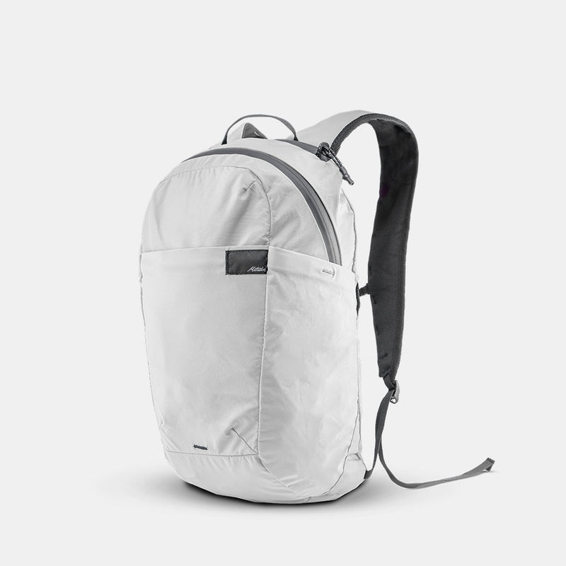 3/4 view of arctic white backpack on white background