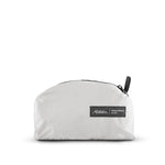 packed up arctic white backpack on white background