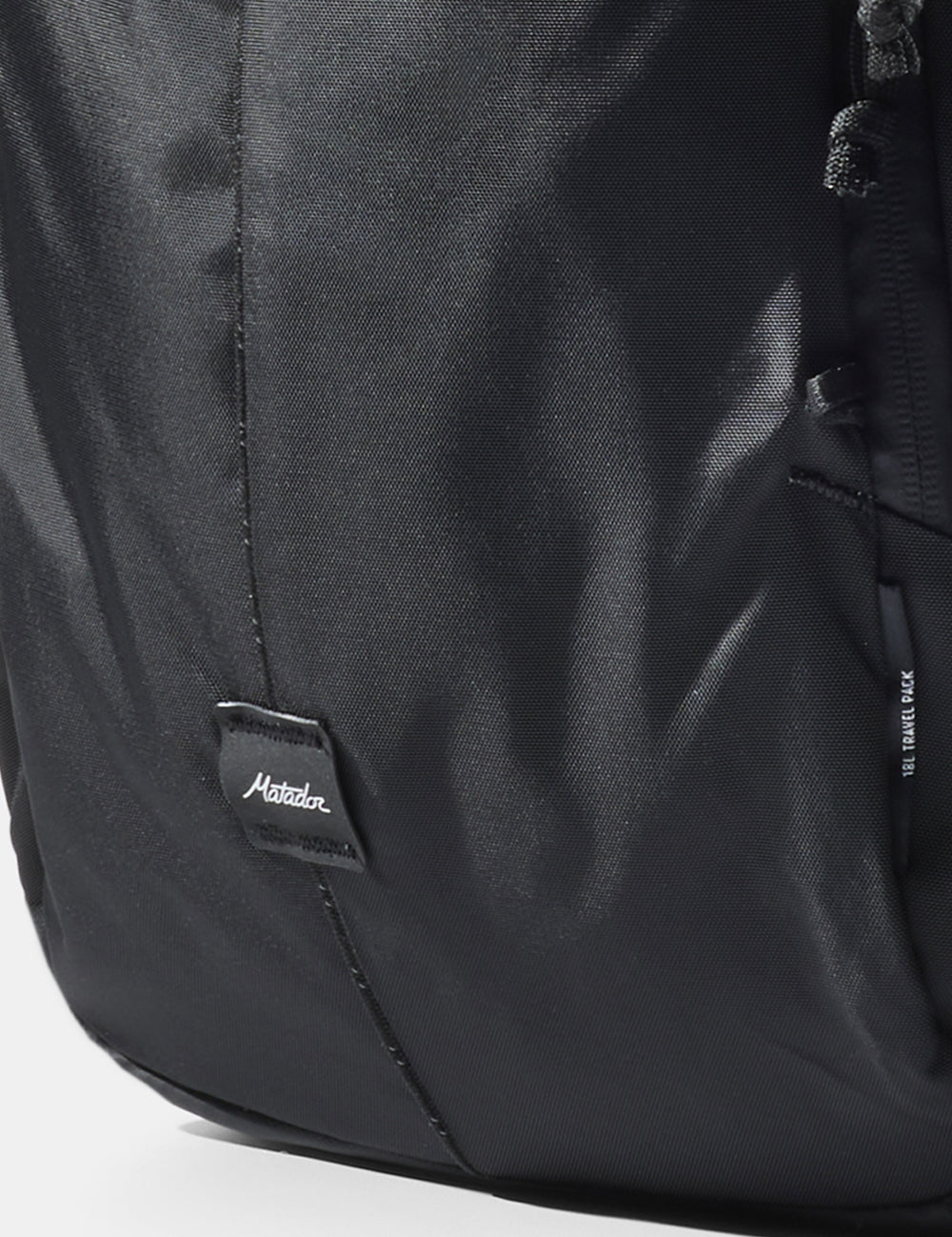close up view of matador logo sewn onto black bag