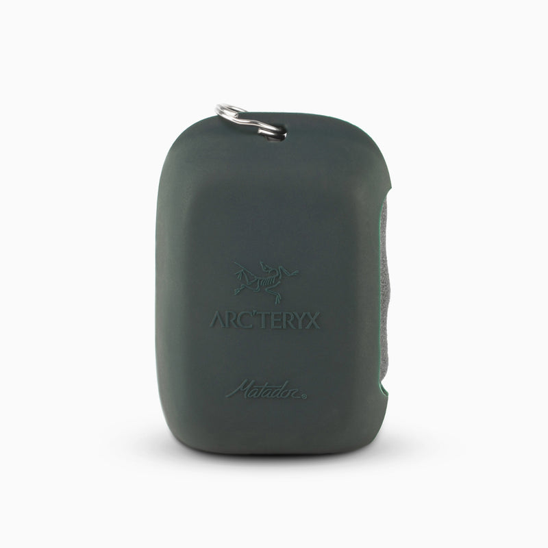 Charcoal NanoDry Trek Towel with Arc'teryx logo on light gray background