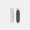 White and black silicone earplug cases laying on light gray background