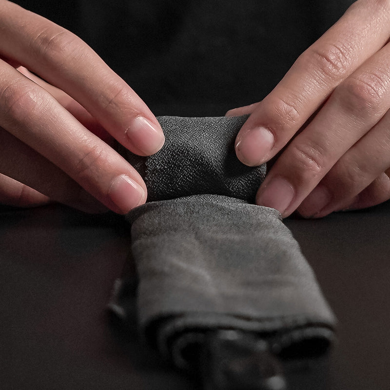 Close up view of  NanoDry Trek Towel material being rolled up