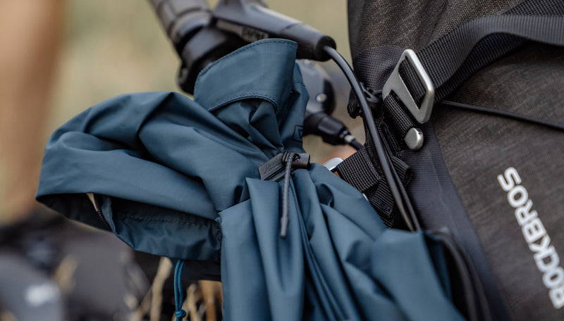 Blue jacket attached to bike handlebars with ReTie