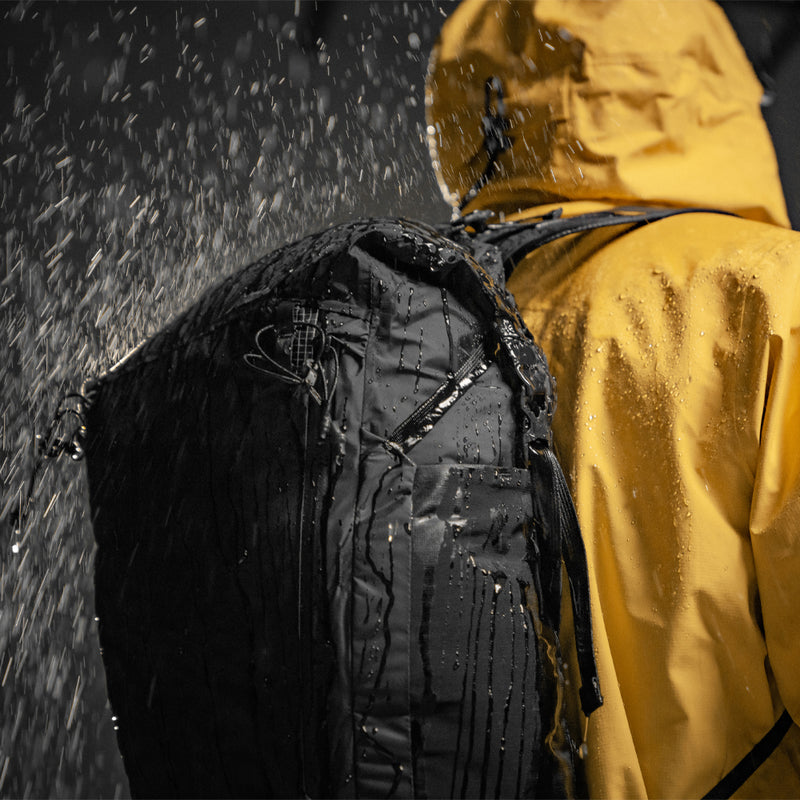 Person in yellow jacket wearing Freerain22 in the rain