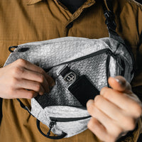 interior view of white sling bag with black patch