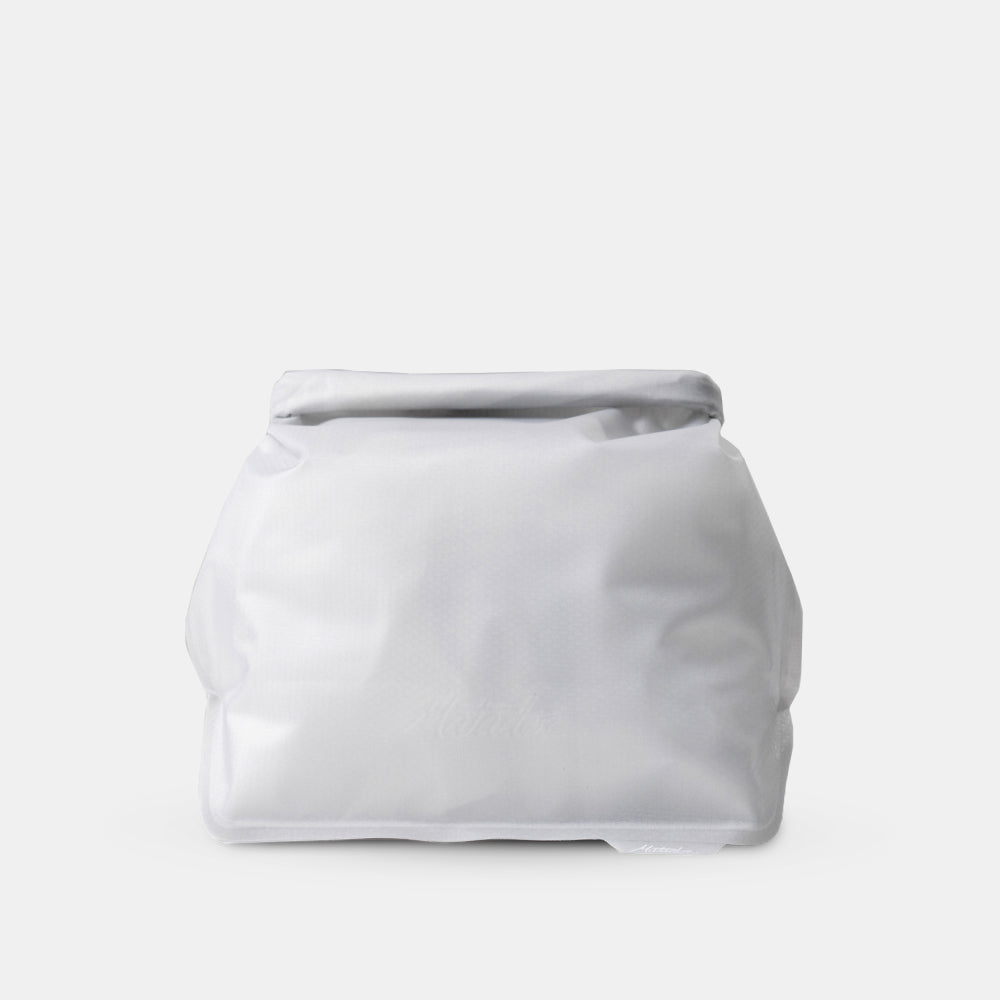 arctic white waterproof toiletry case on light gray background
