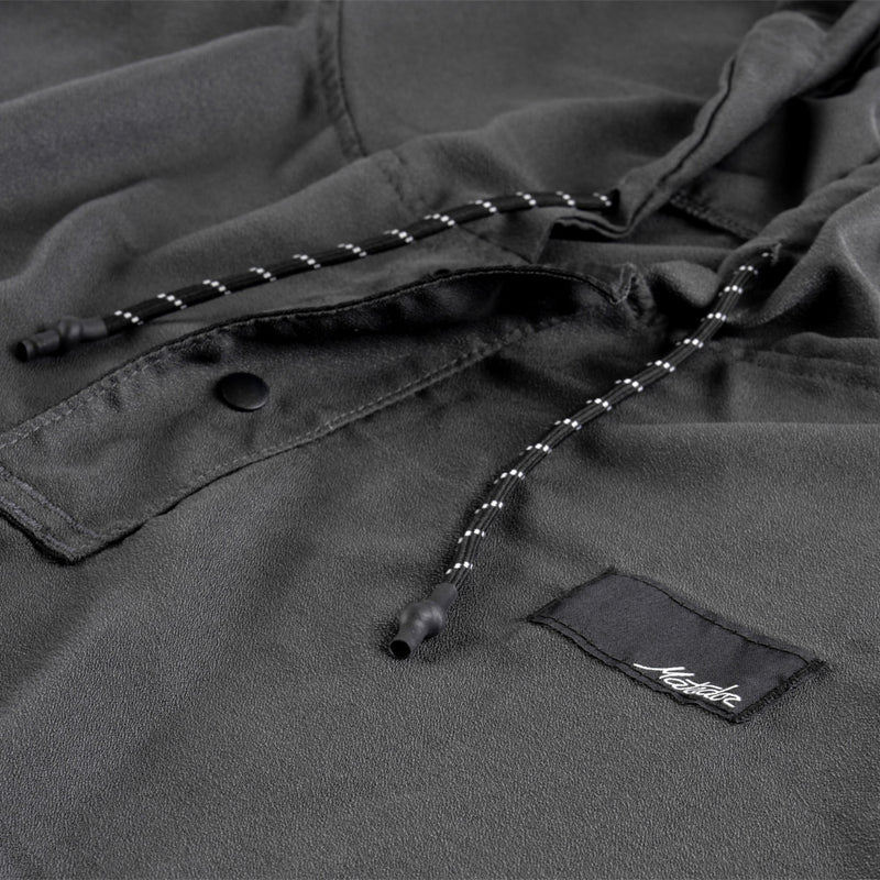 Close up view of charcoal poncho details including hood pull stings and snap button collar 