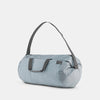 3/4 view of slate blue duffle on white background