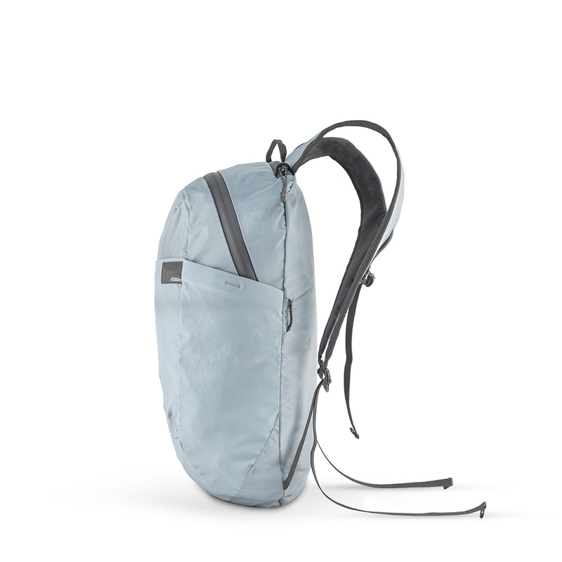 Side view of slate blue backpack on white background