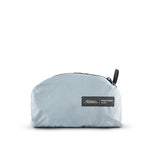 packed up slate blue backpack on white background