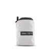 packed up arctic white duffle on white background