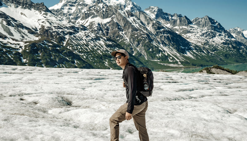 Man wearing Freefly16 in front of snowy Alaskan mountain range