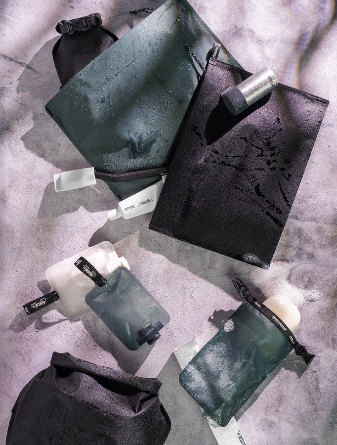 Pile of flatpak toiletry products on marbled background