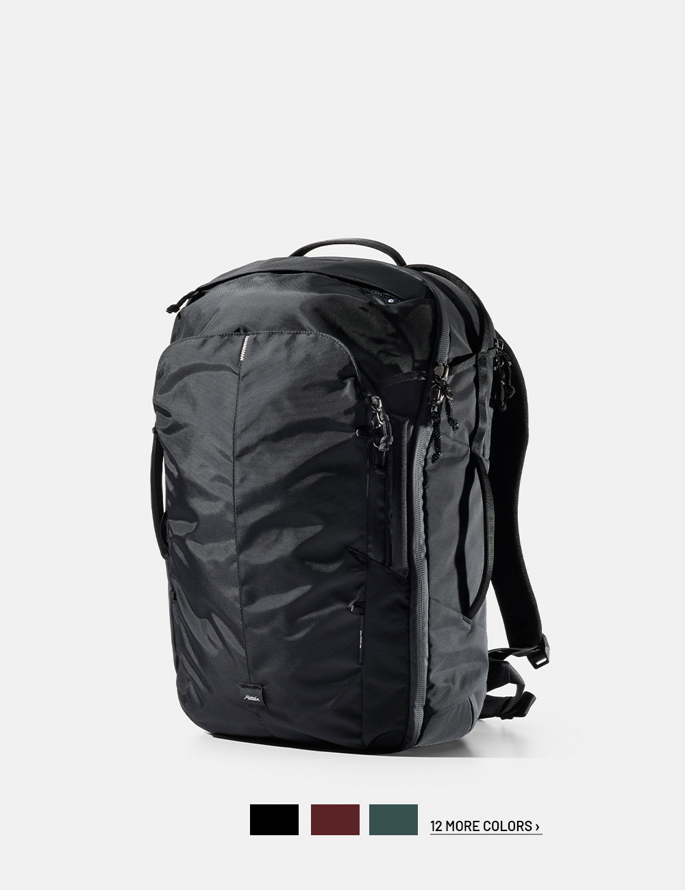 Black backpack on a white background with 3 color swatches and text that reads "12 more colors"
