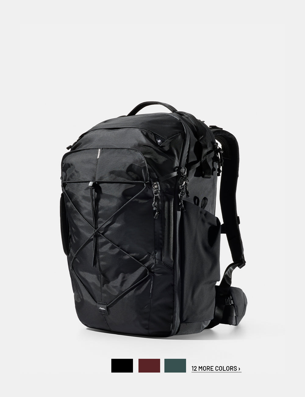 Black backpack on a white background with 3 color swatches and text that reads "12 more colors"