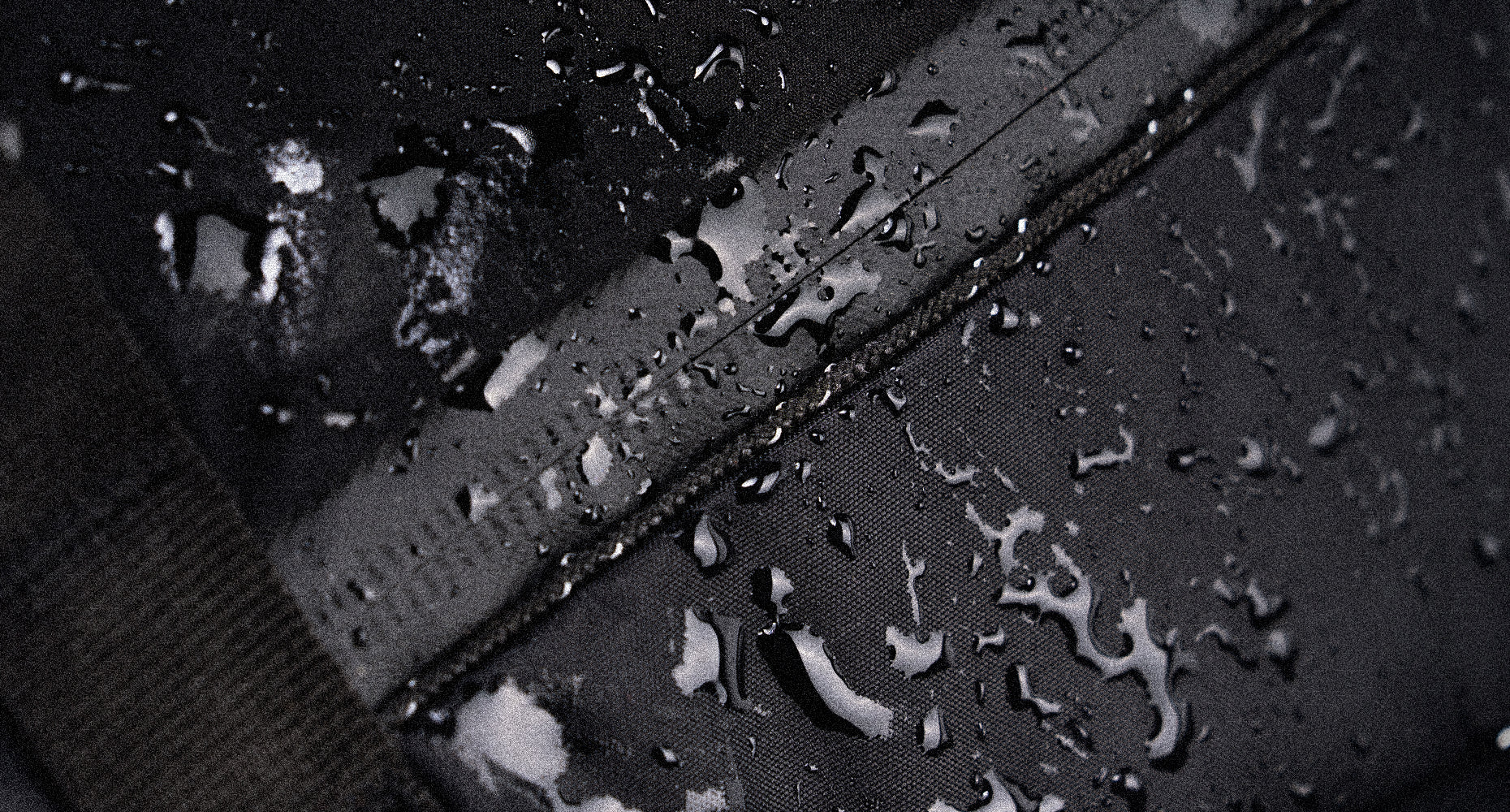 close up view of droplets on waterproof zipper