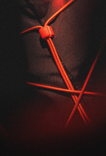 garnet fabric with bright orange cord