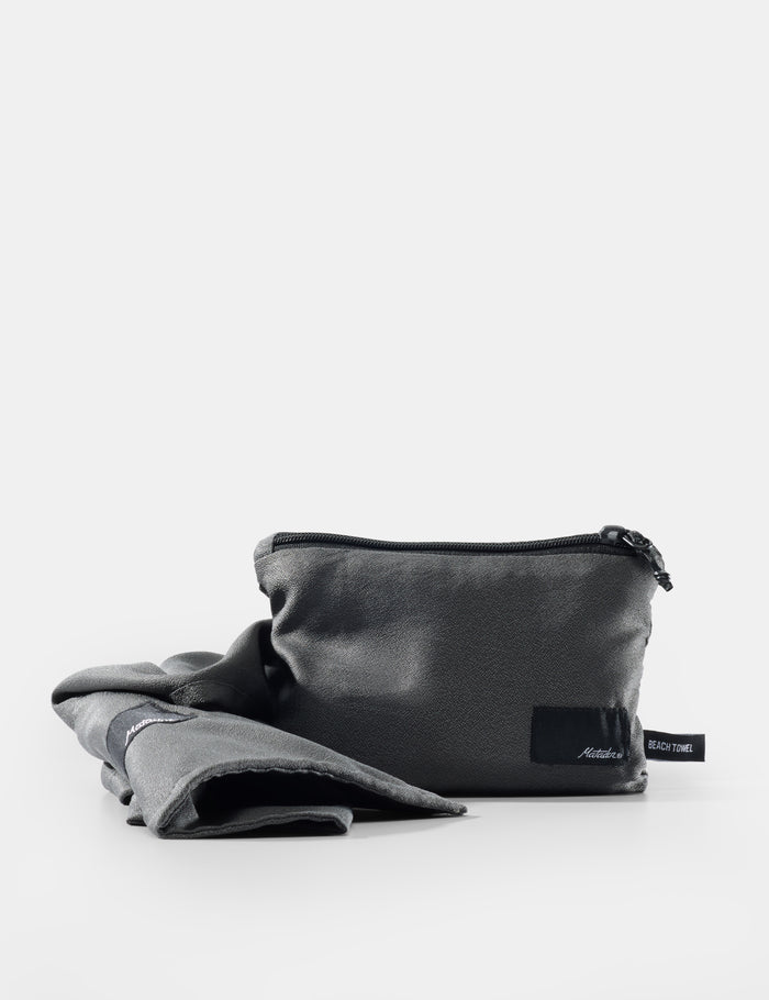 gray pouch with a label on a white background