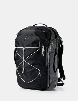 Black backpack with white accents on a light gray background