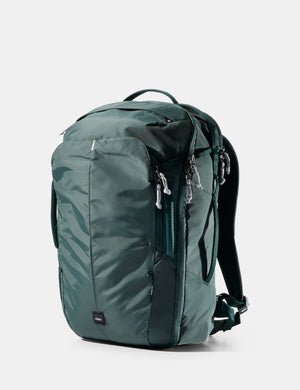 Green backpack on a white background