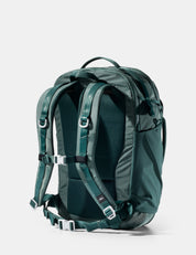 Green backpack on a white background