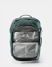 Green backpack with a gray interior on a white background