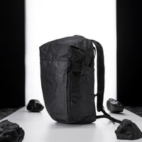 black backpack on light up white studio background
