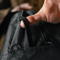 detail view of backpack straps and screenprint