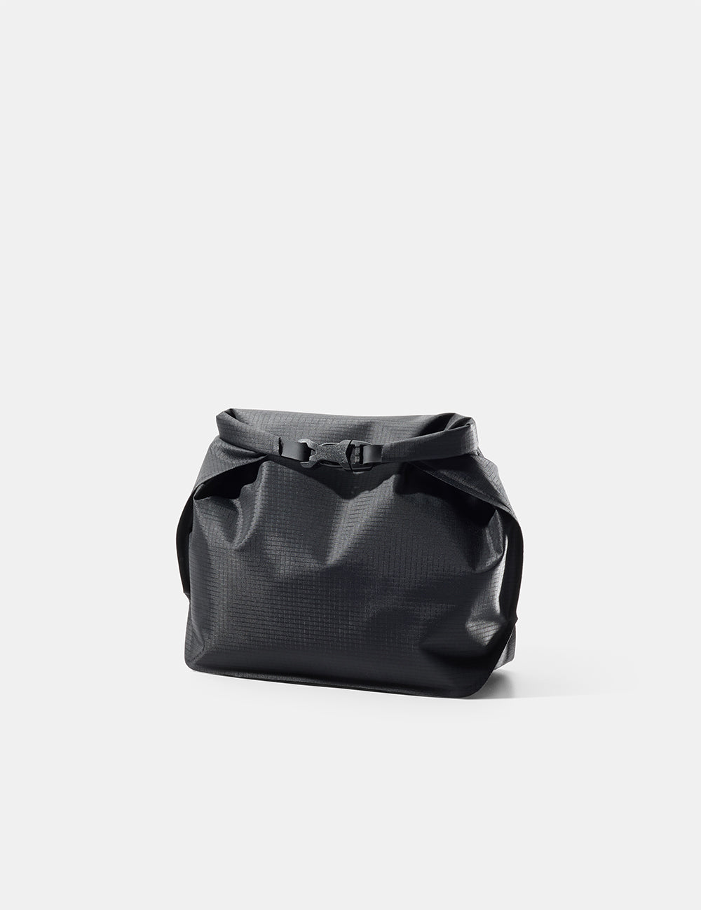 Black toiletry case on a light gray background