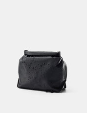 Black toiletry case on a white background