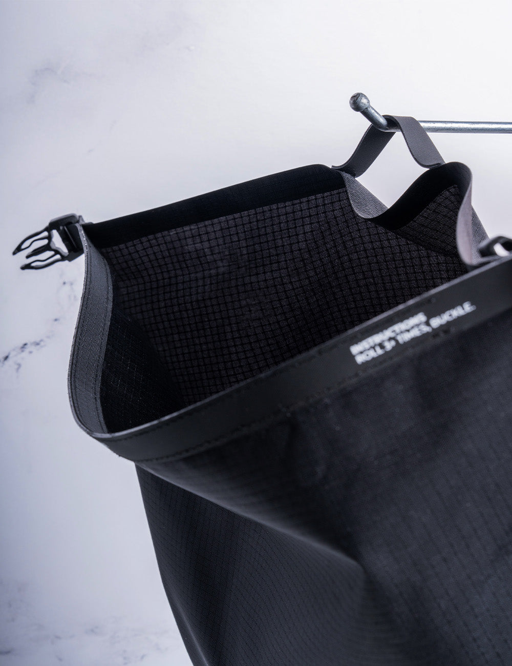 black toiletry bag hanging from hook