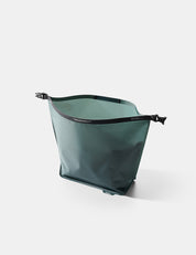 Open Blue-green toiletry bag on a white background