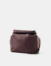 Garnet toiletry bag on a light gray background