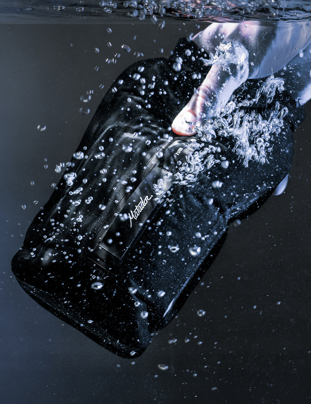 dry bag being dunked into water