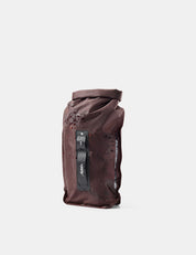 garnet dry bag with water droplets on white background