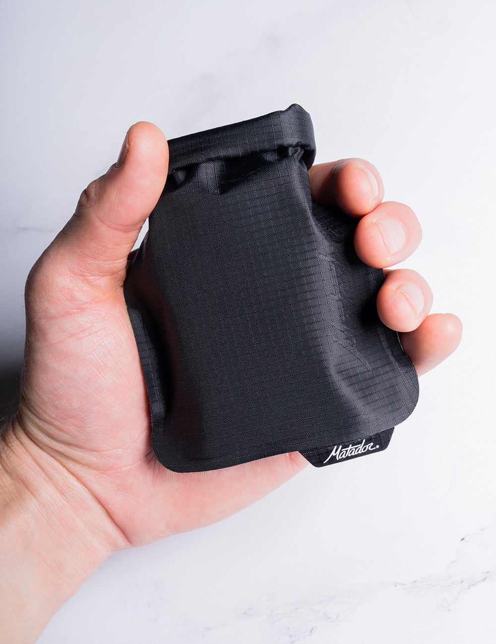 hand holding black soap bar case