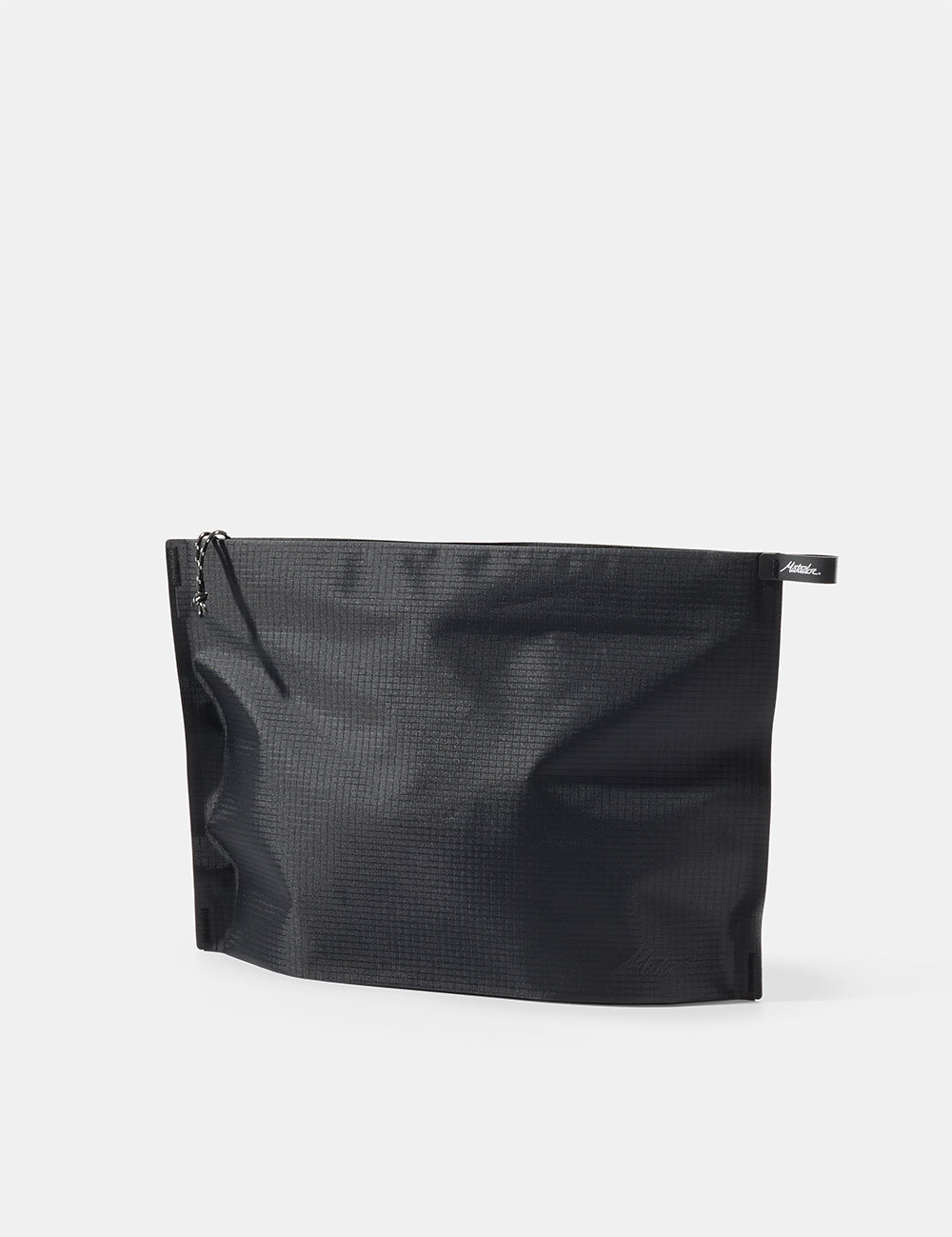Black zippered toiletry case on a white background