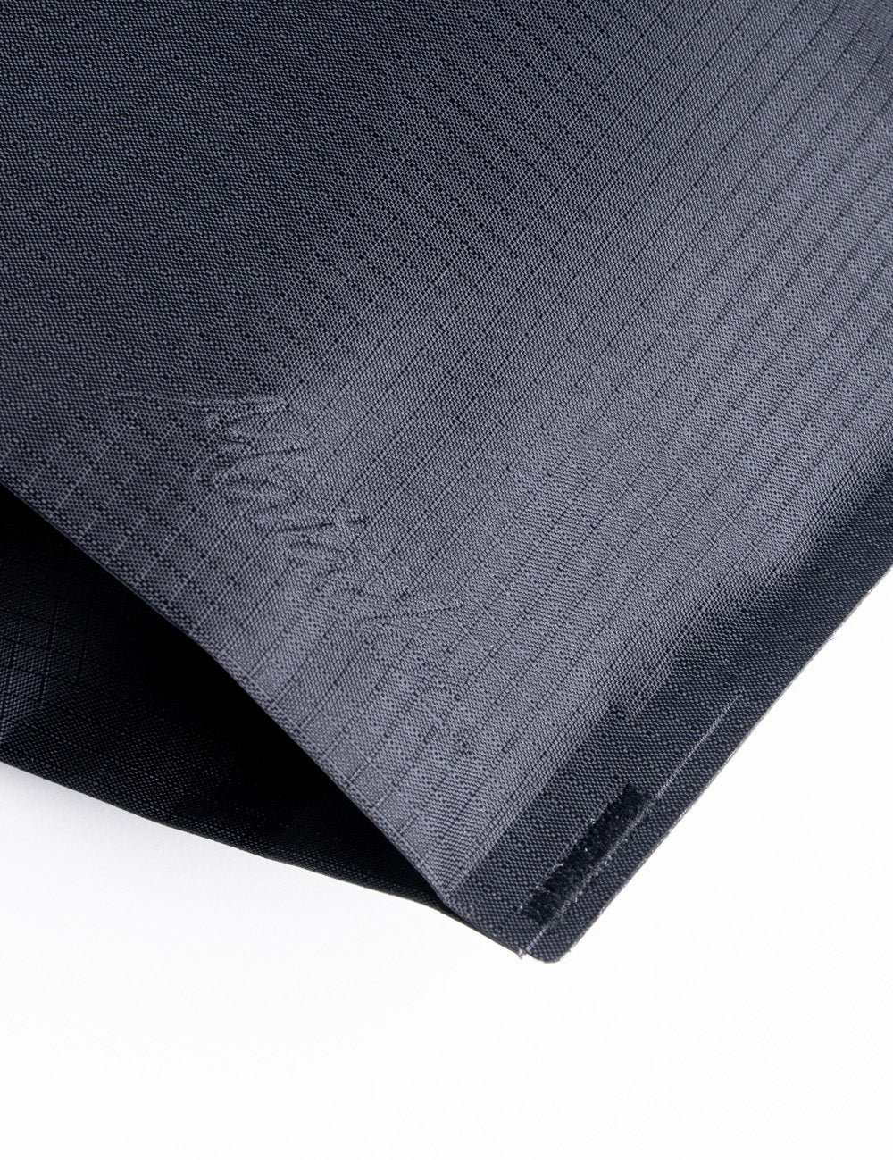 close up view of seams on black toiletry bag