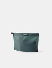 Blue-green zipper toiletry case on a white background