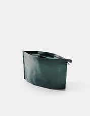 Open Blue-green zipper toiletry case on a white background