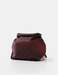 garnet toiletry case on a white background