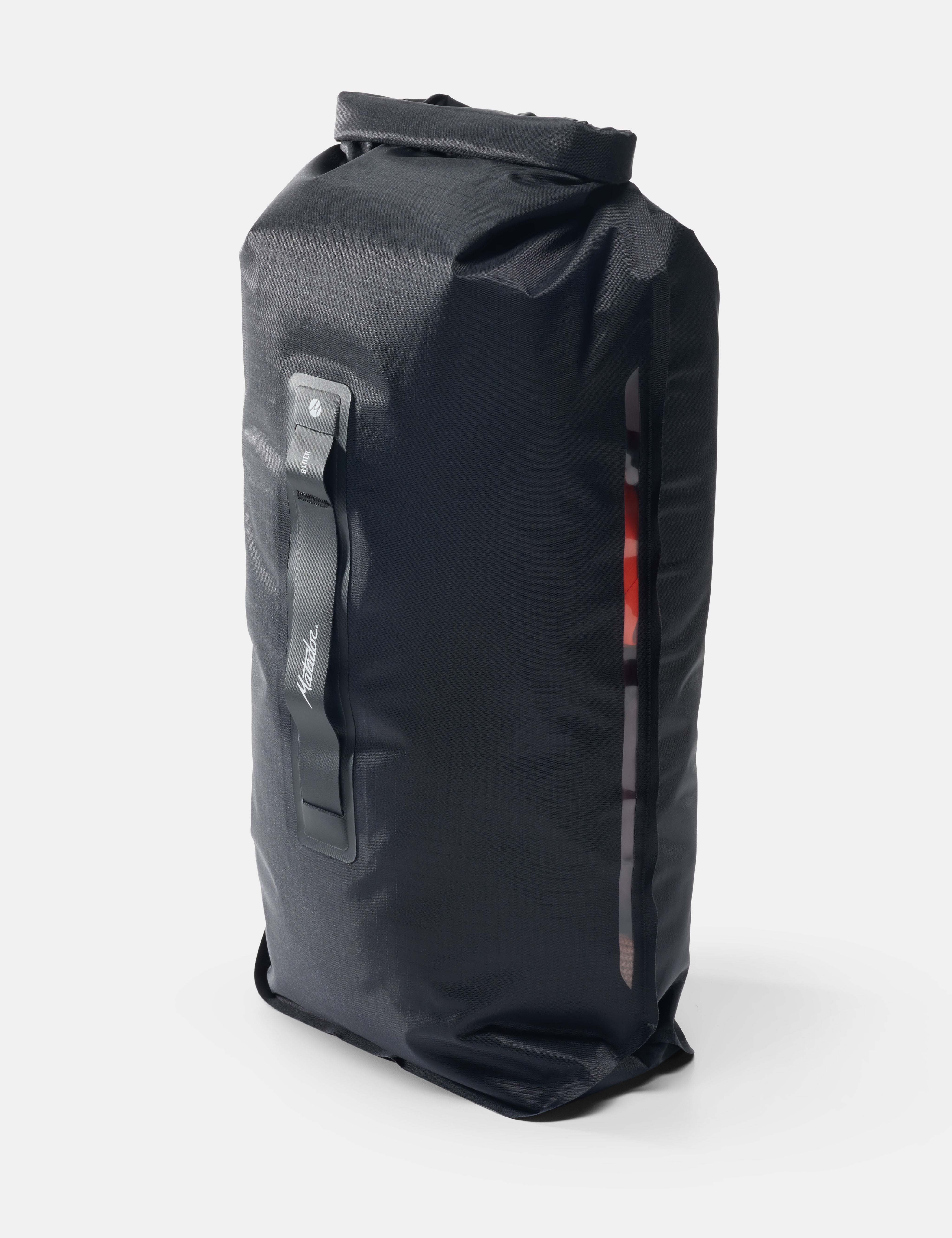 Black dry bag with a strap on a white background