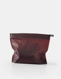 garnet toiletry case on a white background
