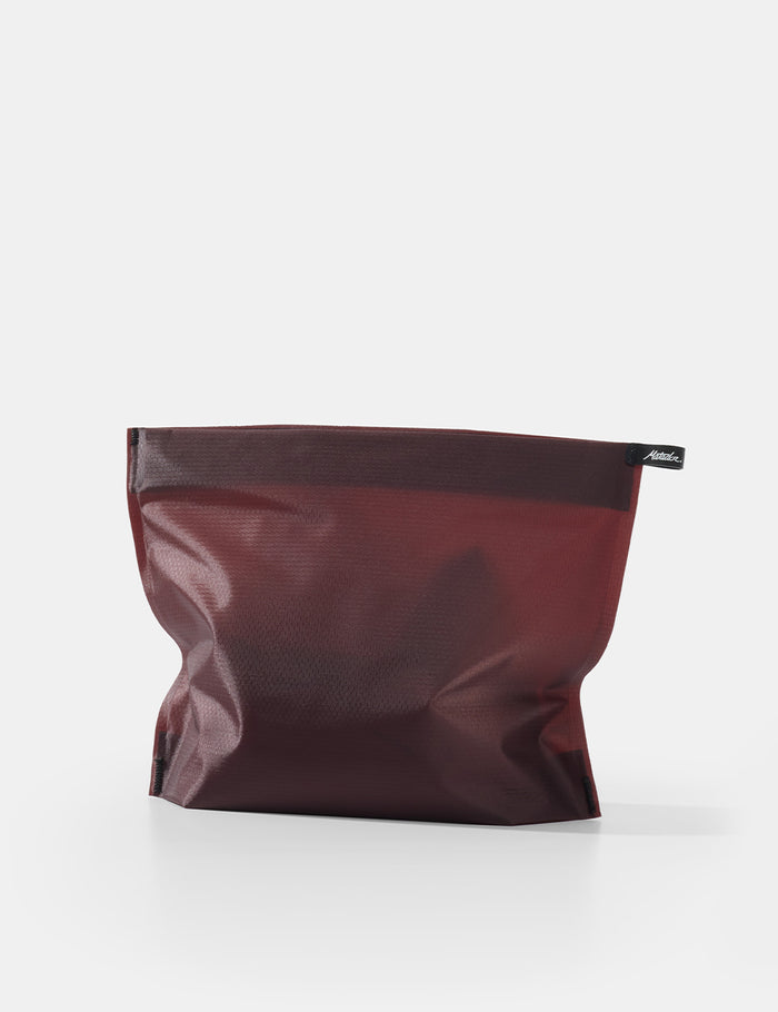 garnet toiletry case on a white background