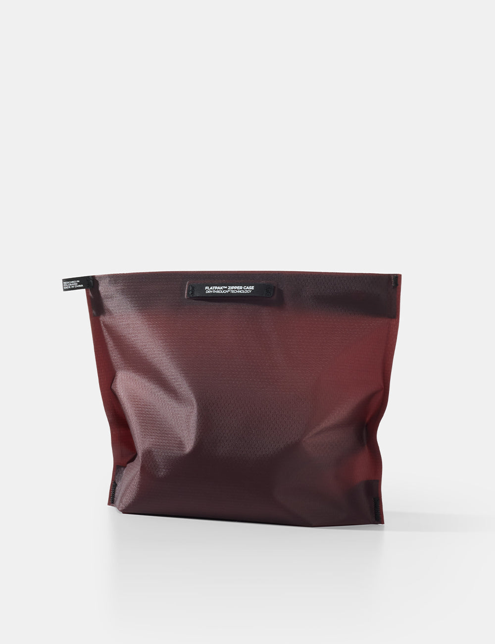 garnet toiletry case on a white background