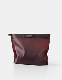 garnet toiletry case on a white background